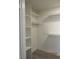 Walk-in closet with custom shelving and wood-look floors, providing ample storage space at 3484 Nightflower Ln # 2, Las Vegas, NV 89121