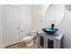 Stylish powder room featuring a vessel sink and gray vanity at 3517 Colby Creek Ave, North Las Vegas, NV 89081