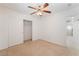 Neutral bedroom with ceiling fan and closet, offering a serene and comfortable space at 3517 Colby Creek Ave, North Las Vegas, NV 89081