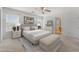 A beautifully staged bedroom with great natural light, with neutral colored decor and furniture at 3517 Colby Creek Ave, North Las Vegas, NV 89081