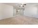 Expansive bonus room with a white staircase and neutral carpeting, offering versatile space at 3517 Colby Creek Ave, North Las Vegas, NV 89081