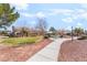 Neighborhood park with walking paths, gazebo, and grassy areas, offering a recreational space for residents at 3517 Colby Creek Ave, North Las Vegas, NV 89081
