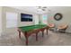 Spacious game room with pool table, dart board, and relaxing seating, perfect for entertaining at 3517 Colby Creek Ave, North Las Vegas, NV 89081