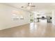 Open living room area with tile floors, recessed lighting, and access to the updated kitchen at 3517 Colby Creek Ave, North Las Vegas, NV 89081
