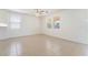 Open and airy living space with tile floors, ceiling fan, and multiple windows for natural light at 3517 Colby Creek Ave, North Las Vegas, NV 89081