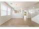 Inviting living area with tile floors, staircase, and natural light creating a warm atmosphere at 3517 Colby Creek Ave, North Las Vegas, NV 89081