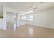 Bright living room featuring tile floors, modern lighting, and an open layout to other areas at 3517 Colby Creek Ave, North Las Vegas, NV 89081