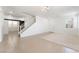 Spacious living area with modern lighting, staircase, and tile flooring at 3517 Colby Creek Ave, North Las Vegas, NV 89081