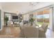 Spacious living area open to the dining area, featuring sliding glass doors to the backyard and modern finishes at 3517 Colby Creek Ave, North Las Vegas, NV 89081