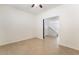 Bright, open living area with tile floors, ceiling fan and an open entry to the staircase at 3517 Colby Creek Ave, North Las Vegas, NV 89081