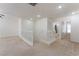 Spacious upstairs landing leading to a bathroom, featuring plush carpeting and abundant natural light at 3517 Colby Creek Ave, North Las Vegas, NV 89081