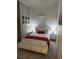Neutral toned bedroom featuring a platform bed and modern decor at 353 E Bonneville Ave # 449, Las Vegas, NV 89101