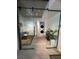Hallway featuring a laundry room and office area with sliding glass doors at 353 E Bonneville Ave # 449, Las Vegas, NV 89101