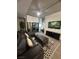 Cozy living room features a large sectional, an area rug and entertainment center at 353 E Bonneville Ave # 449, Las Vegas, NV 89101