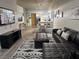 Spacious open-concept living area featuring a modern kitchen, dining area, and comfortable seating, great for entertaining at 353 E Bonneville Ave # 449, Las Vegas, NV 89101