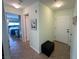 Hallway showcasing the front door, storage ottoman, and a glimpse of the bedroom at 3550 Bay Sands Dr # 3044, Laughlin, NV 89029
