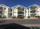 Low-angle exterior showcasing the condos with second and third-floor balconies at 3550 Bay Sands Dr # 3044, Laughlin, NV 89029
