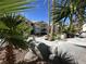 Beautiful condo community showcasing architectural features and mature landscaping, highlighted by rock formations and tall palms at 3550 Bay Sands Dr # 3044, Laughlin, NV 89029