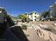 Charming condo complex with lush landscaping, including a rock garden and diverse desert foliage, creating a serene atmosphere at 3550 Bay Sands Dr # 3044, Laughlin, NV 89029
