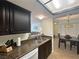 This kitchen features granite countertops with a breakfast bar overlooking the adjacent dining room at 3550 Bay Sands Dr # 3044, Laughlin, NV 89029