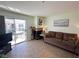 Bright living room with a sliding glass door to the patio and a decorative fireplace at 3550 Bay Sands Dr # 3044, Laughlin, NV 89029