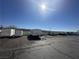 View of a storage lot, filled with multiple RVs and trailers of various sizes, basking under sunlight at 3550 Bay Sands Dr # 3044, Laughlin, NV 89029