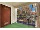 This balcony features a beautiful view of the nearby trees and a black metal railing at 3609 Melonies Dr # 93, Las Vegas, NV 89103