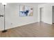 Bright bedroom with modern lighting, wood-look floors, and closet at 3609 Melonies Dr # 93, Las Vegas, NV 89103