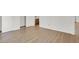 Spacious bedroom featuring wood-look floors, closet, and bathroom at 3609 Melonies Dr # 93, Las Vegas, NV 89103