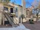 Two-story townhouse with stairs leading to the front door of unit #93 at 3609 Melonies Dr # 93, Las Vegas, NV 89103