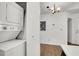 Laundry closet with a stacked washer and dryer plus extra storage space and a hanging light fixture at 3609 Melonies Dr # 93, Las Vegas, NV 89103