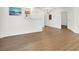 Bright and airy living space with wood laminate flooring leading into a kitchen area at 3609 Melonies Dr # 93, Las Vegas, NV 89103