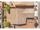 An aerial view shows a roof and backyard with mature tree and gravel landscaping at 4399 Luciano Ave, Pahrump, NV 89061