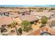 An aerial view of a private backyard with gravel landscaping, a brick fence, and a small pool at 4399 Luciano Ave, Pahrump, NV 89061