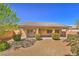 Spacious backyard with desert landscaping, offering a serene and low-maintenance outdoor space for relaxation at 4399 Luciano Ave, Pahrump, NV 89061