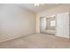 Cozy bedroom featuring a ceiling fan, mirrored closet doors, and soft carpeting at 4399 Luciano Ave, Pahrump, NV 89061