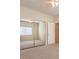 Bedroom with a ceiling fan, large mirrored closet and soft carpet at 4399 Luciano Ave, Pahrump, NV 89061