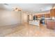 Open kitchen with tile flooring, an island bar, and stainless steel appliances at 4399 Luciano Ave, Pahrump, NV 89061