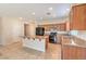 Well-designed kitchen boasts granite countertops, stainless appliances, and an island bar at 4399 Luciano Ave, Pahrump, NV 89061