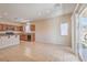 Open concept kitchen with stainless appliances, granite countertops, and a large connected living area at 4399 Luciano Ave, Pahrump, NV 89061