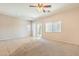 Spacious living room featuring tile floors and lots of natural light through the windows at 4399 Luciano Ave, Pahrump, NV 89061