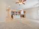 Open living area with tile floors, and kitchen with granite countertops and appliances at 4399 Luciano Ave, Pahrump, NV 89061