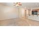 Open living area with tile floors, carpet and kitchen with granite countertops at 4399 Luciano Ave, Pahrump, NV 89061