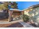 Relaxing backyard with a gazebo, desert landscaping, and mature trees providing ample shade at 4405 Testarossa Ln, North Las Vegas, NV 89081