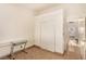 Bedroom features a closet, tile floor and desk at 4405 Testarossa Ln, North Las Vegas, NV 89081
