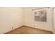 Bedroom with tile floor, white walls and window at 4405 Testarossa Ln, North Las Vegas, NV 89081