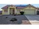 Charming single-story home with a red tile roof, solar panels, and low-maintenance desert landscaping at 4405 Testarossa Ln, North Las Vegas, NV 89081
