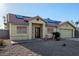 Inviting single-story home with solar panels, desert landscaping, and a two-car garage at 4405 Testarossa Ln, North Las Vegas, NV 89081