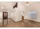 Bright living room featuring tile floors, a vaulted ceiling, and plenty of natural light at 4405 Testarossa Ln, North Las Vegas, NV 89081