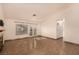 Bright living area features tiled floors, natural light, and access to the outdoor space at 4405 Testarossa Ln, North Las Vegas, NV 89081